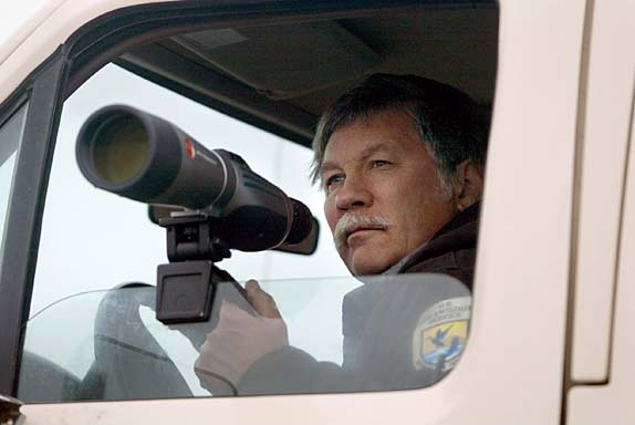 GLOBALWARM_ALASKA_276_KW.jpgOn 9/11/05 in Kaktovik AK as the sun sets, Scott Schliebe, with US Fish and Wildlife Service observes Polar Bear interactions and feeding habits at the end of the airport runway in the Inupiat Eskimo village of Kaktovik on Barter Island in the artic sea where villagers dump the bowhead whale carcasses from the three whales they are allowed to hunt each year in their subsistence hunting village. Kat Wade/The Chronicle                                                                                                             